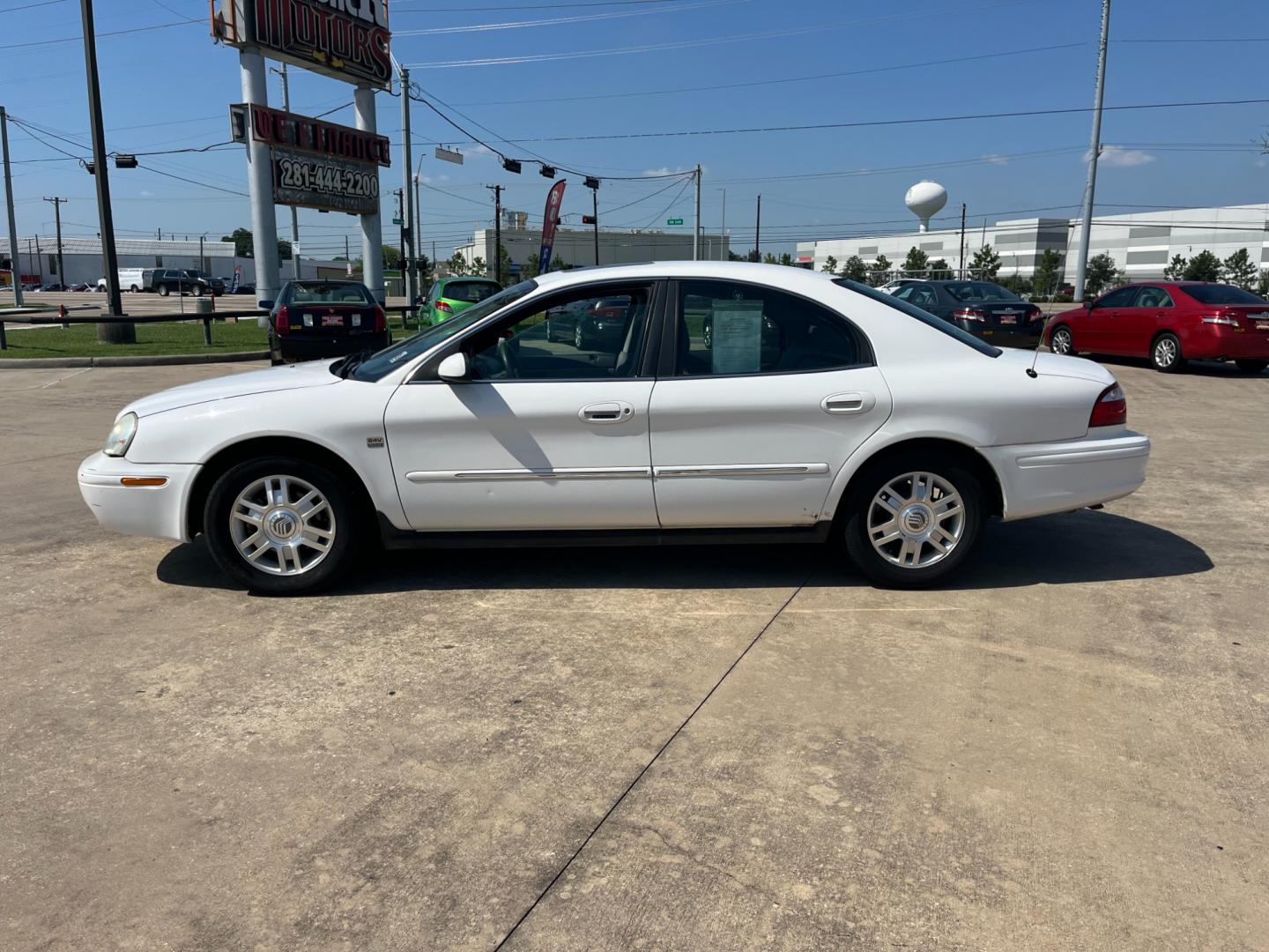 2004 white /TAN Mercury Sable LS Premium (1MEHM55S54A) with an 3.0L V6 SOHC 24V engine, 4-Speed Automatic Overdrive transmission, located at 14700 Tomball Parkway 249, Houston, TX, 77086, (281) 444-2200, 29.928619, -95.504074 - Photo#3